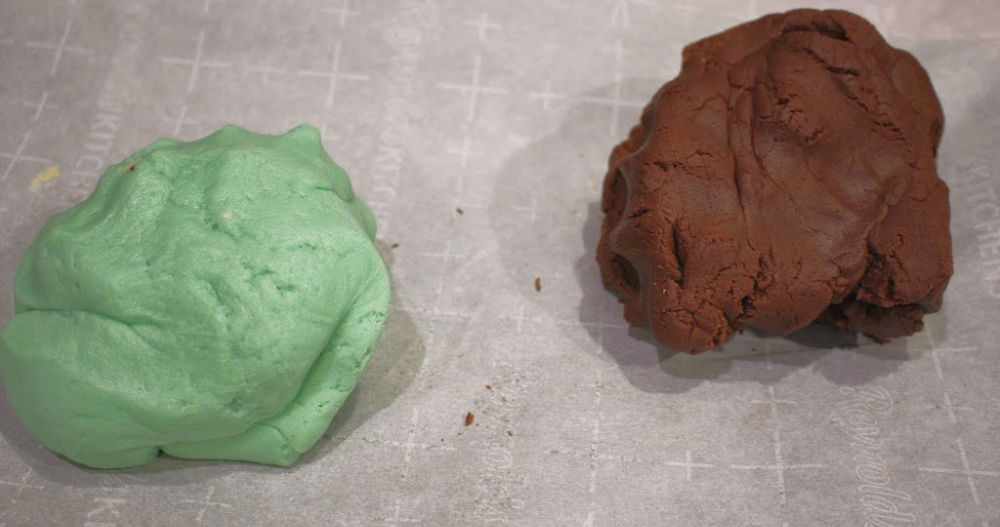 two balls of mint chocolate pinwheel dough