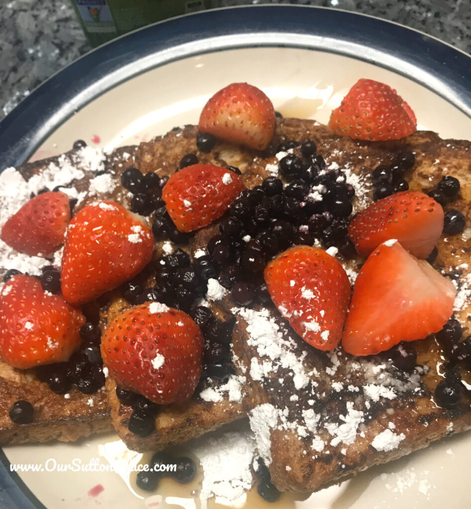plate of berry covered low fat sliced bread French Toast