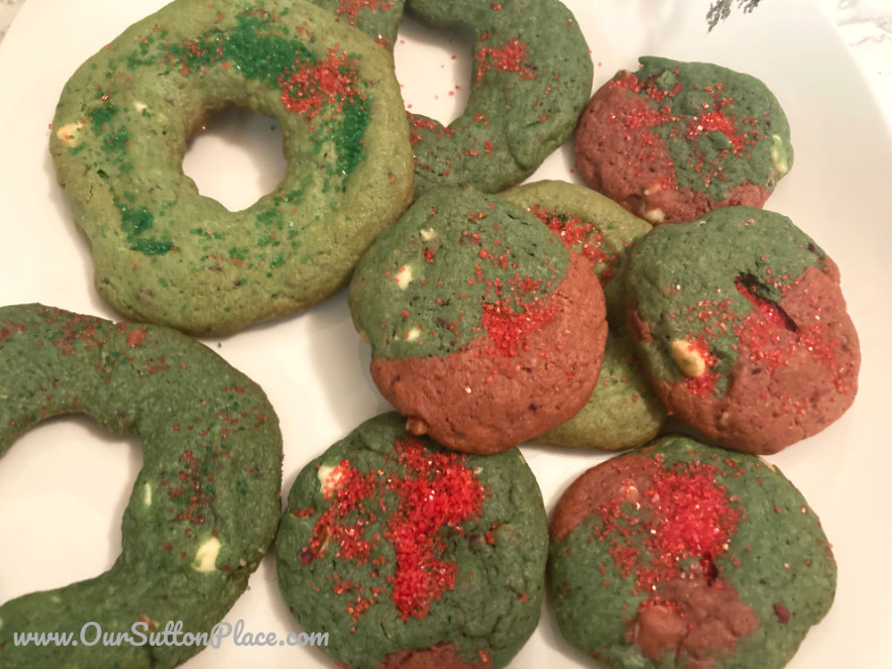 plate full of green and red White Chocolate Raspberry Pecan Christmas cookies