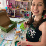 Girl using a KiwiCrate Stem project